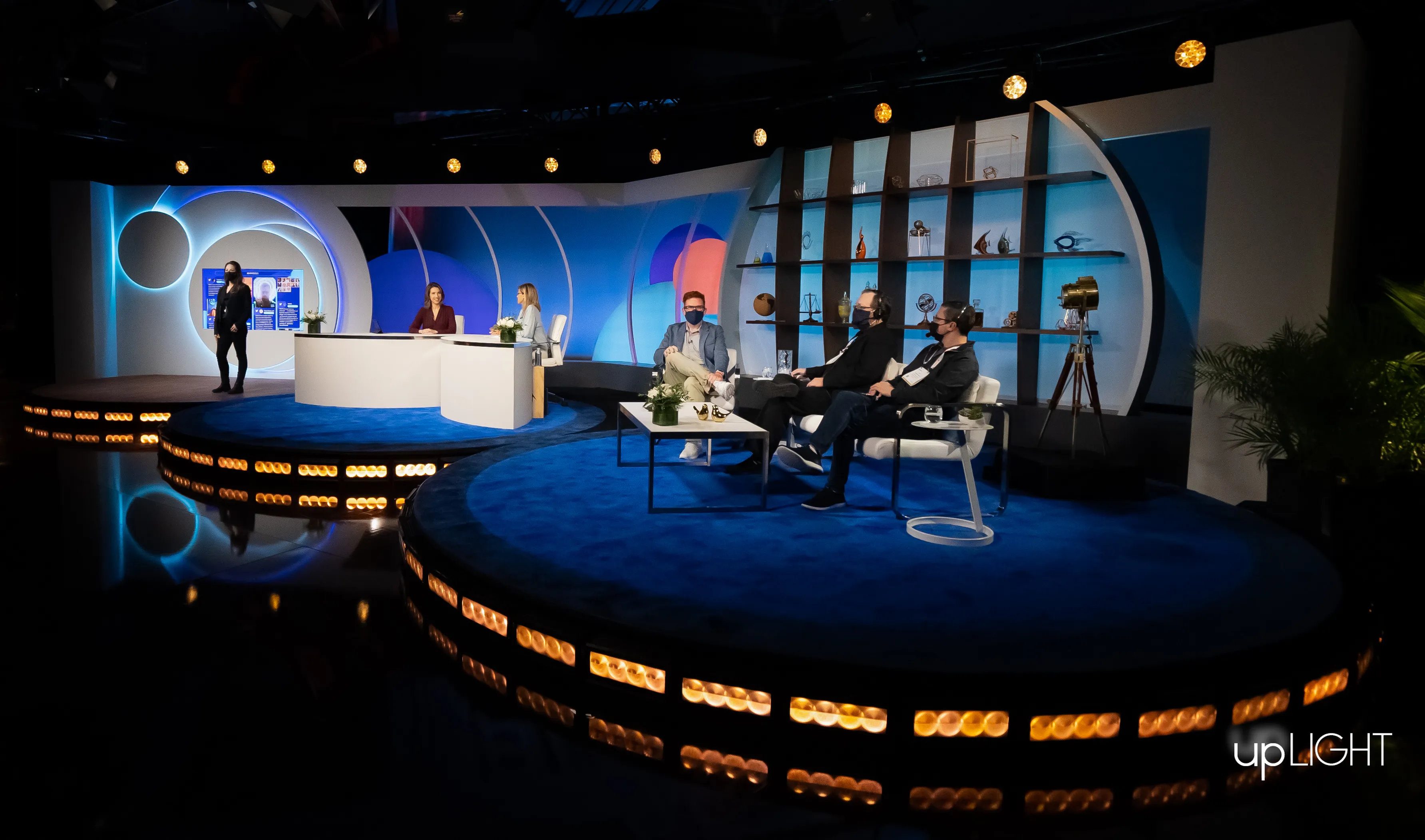 The finished studio in Las Vegas: anchors at the news desk, guests in the interview area